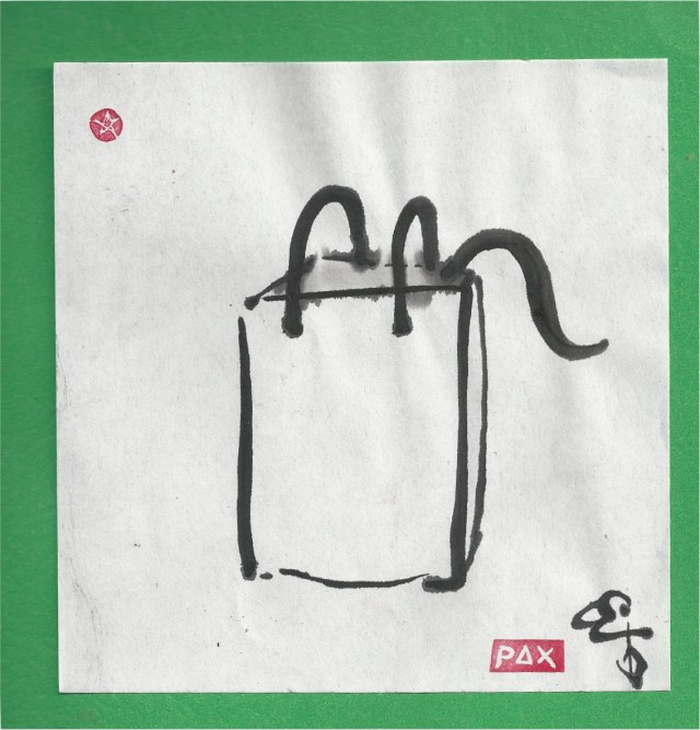 kitten in bag on green