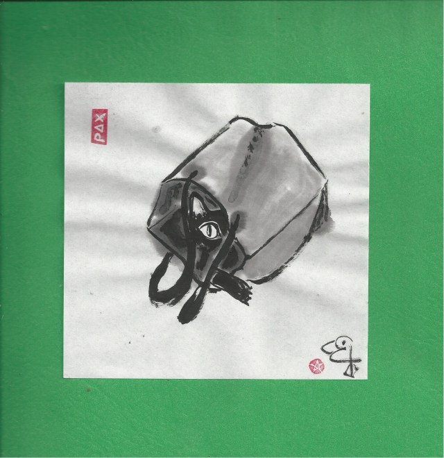 kitten seen in bag on green-1