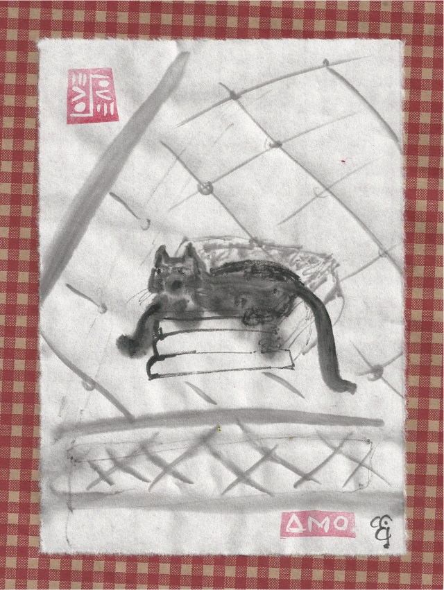 cat on stack of sheets on stripped bed