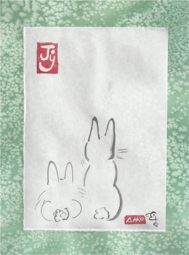 two bunnies waiting together