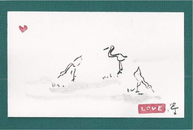 three cranes grazing