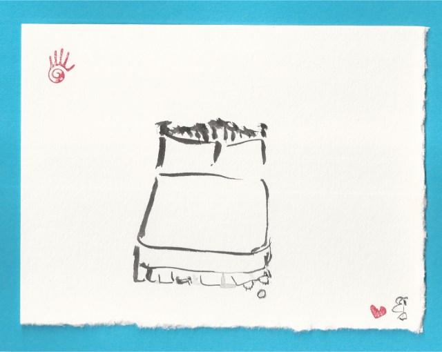 bed with cat paws and small ball