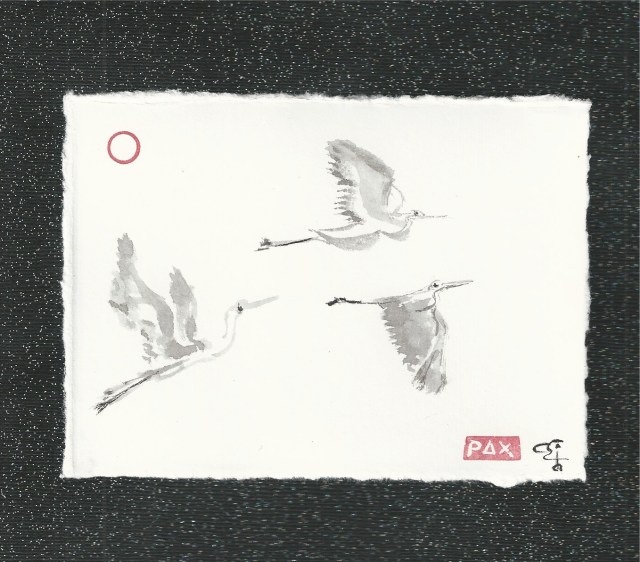 three egrets in flight