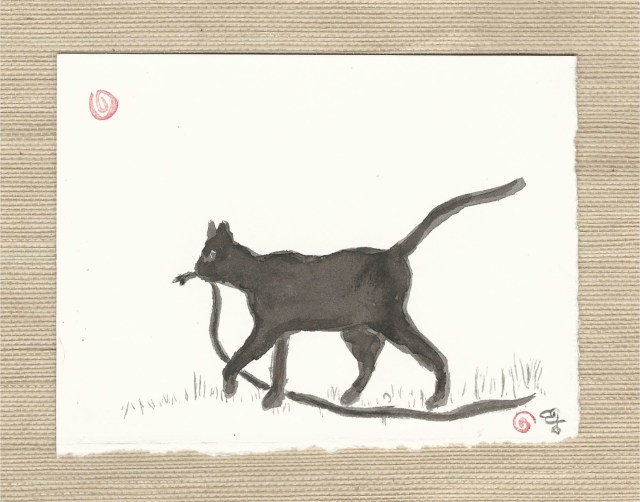 black cat with snake in mouth