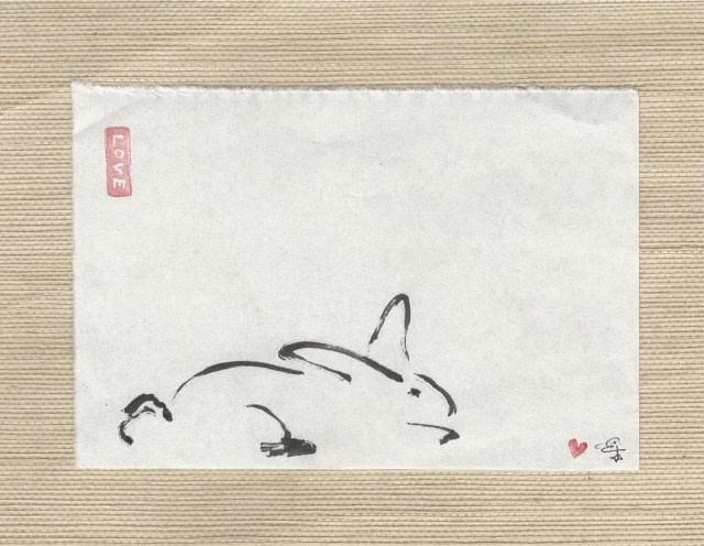 rabbit lower left lying down