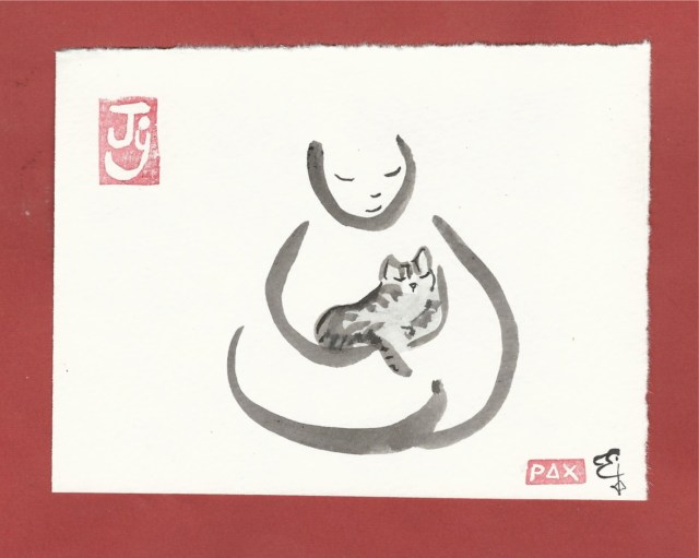 tabby cat in buddha arms