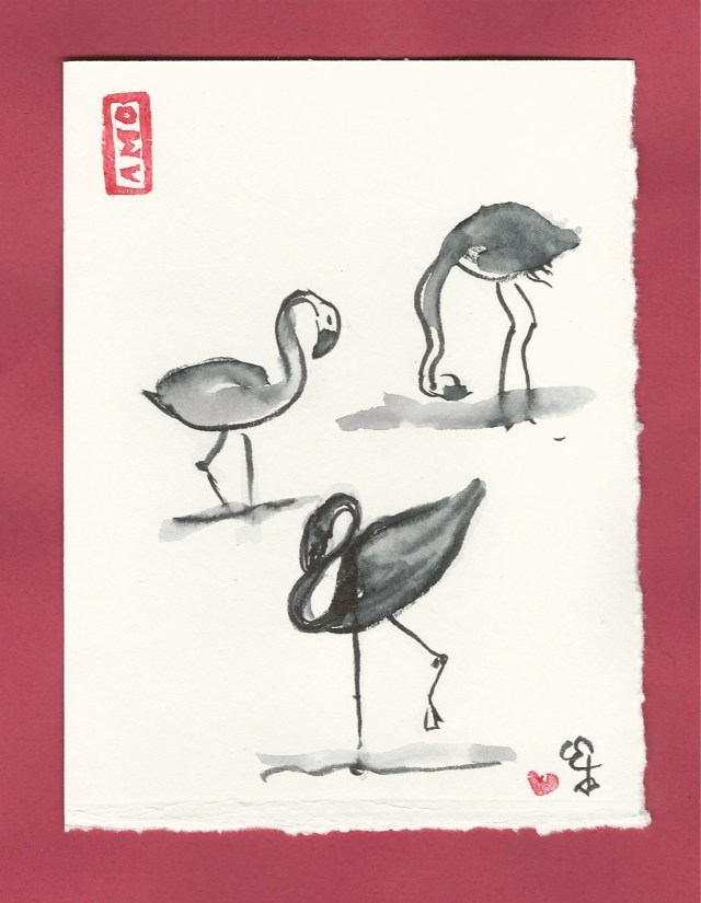 three flamingos