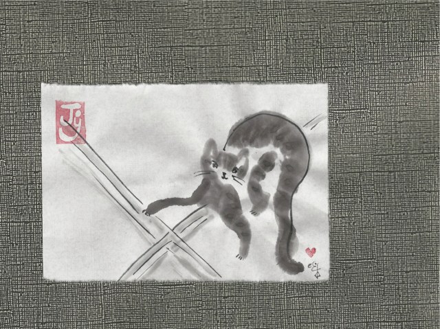 kitten weaving prayer rug