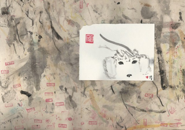 tomi-with-hand-on-head