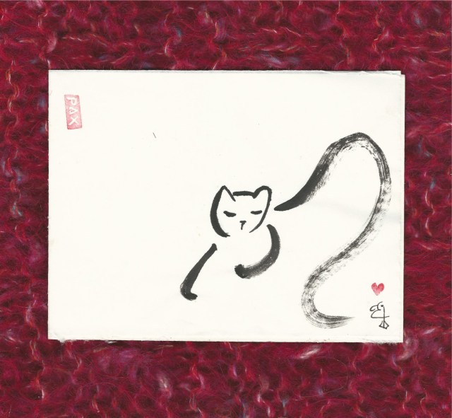 kneading-cat-on-red-afghan