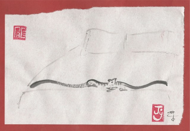 twins-two-tails-at-the-foot-of-the-bed